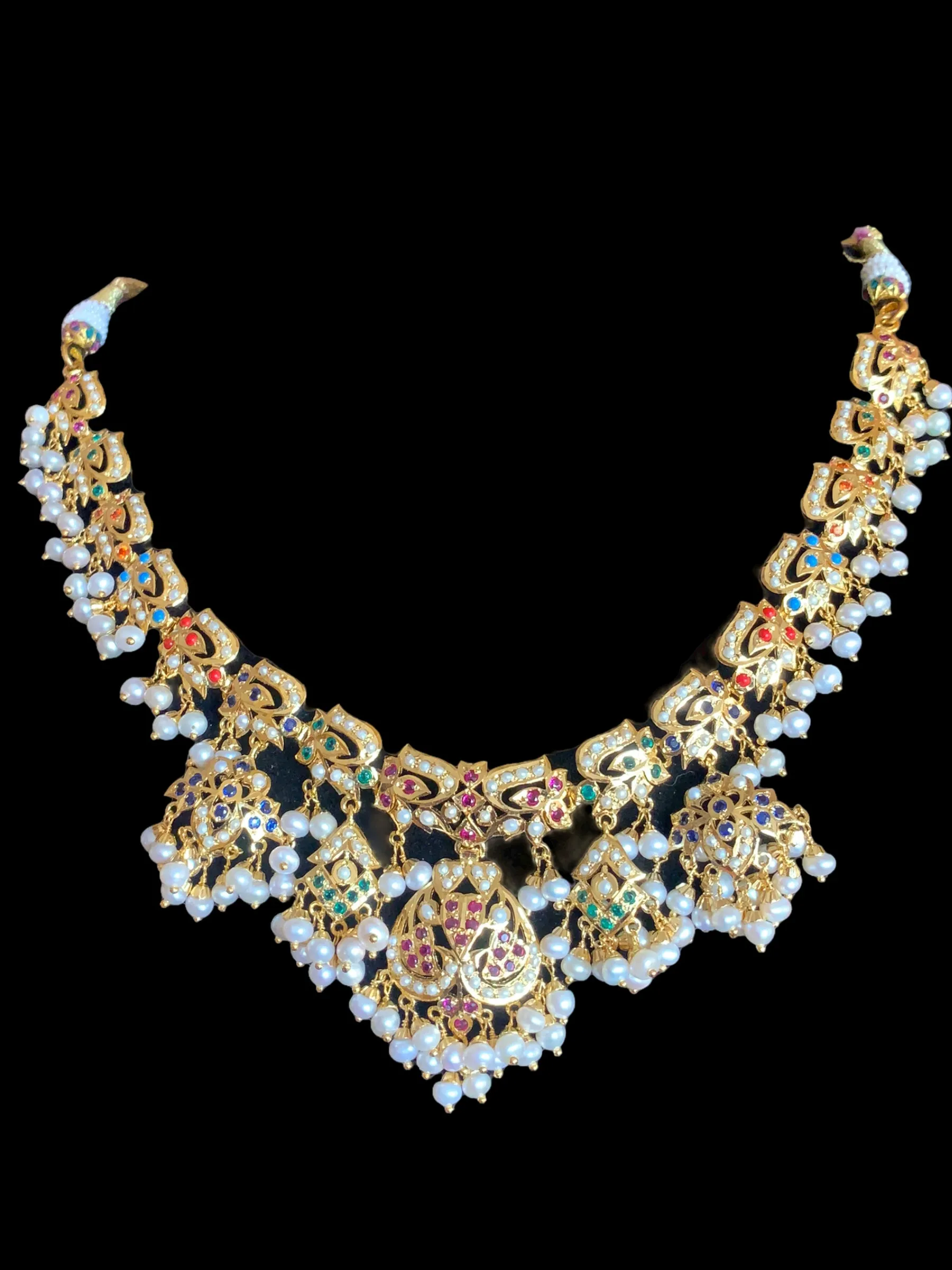 Navratan necklace  set with fresh water pearls in gold plated silver