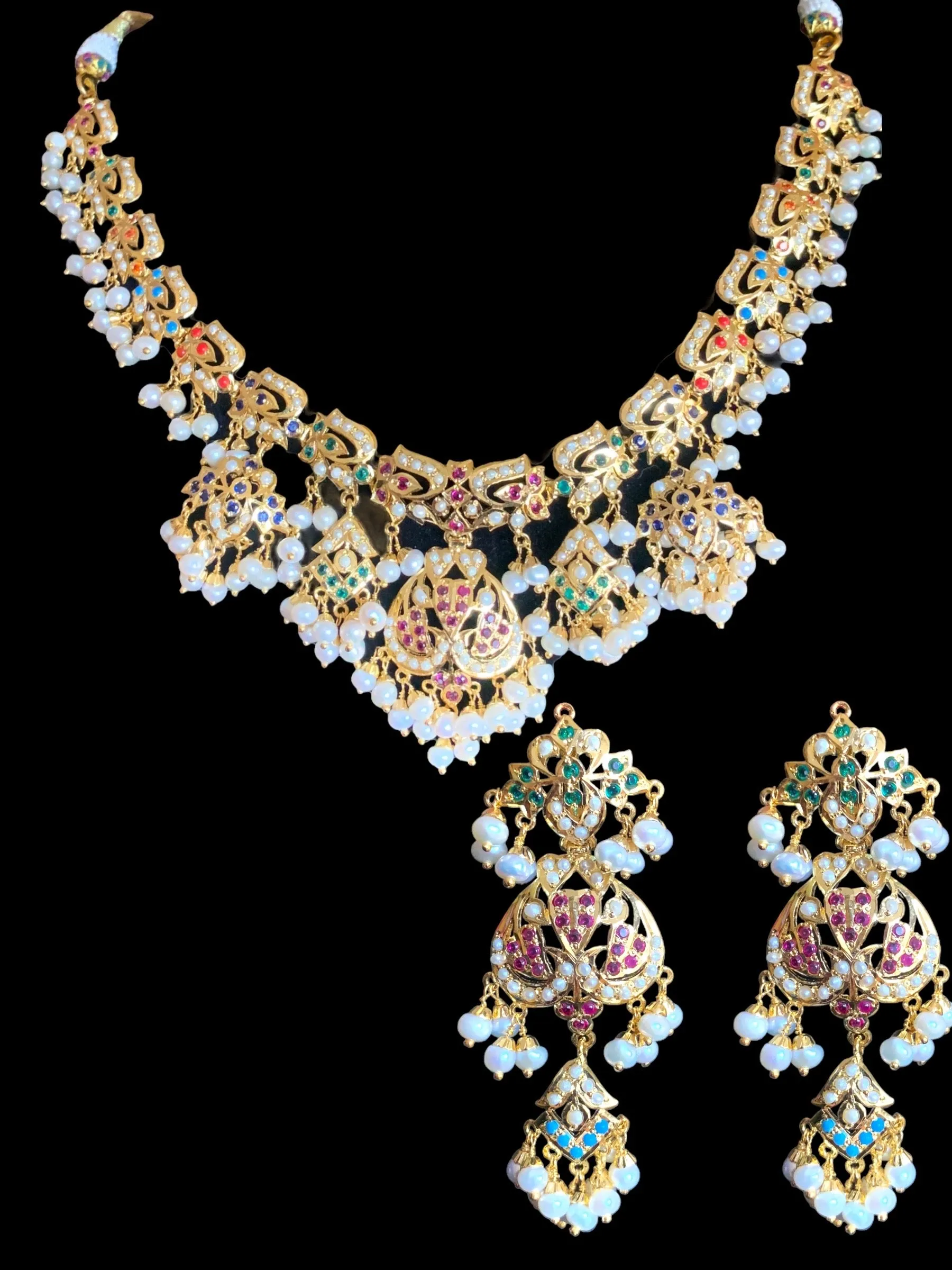 Navratan necklace  set with fresh water pearls in gold plated silver